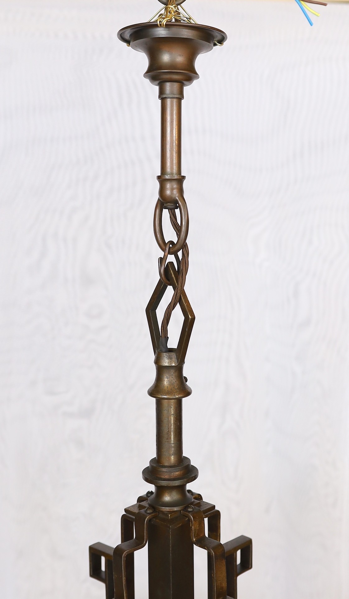 An Art Deco bronze and glass light fitting with four beaded frosted shades. height 81cm. width 54cm